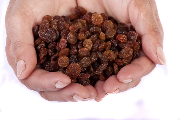Hands with raisins — Stock Photo, Image