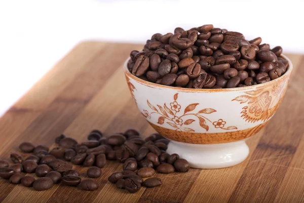 Beans of coffee on a bowl — Stock Photo, Image