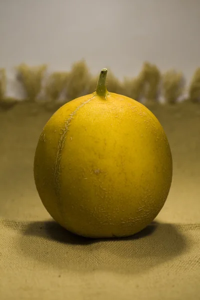 Yellow melon on fabric — Stock Photo, Image