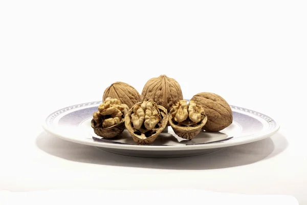 Walnuts on a plate — Stock Photo, Image