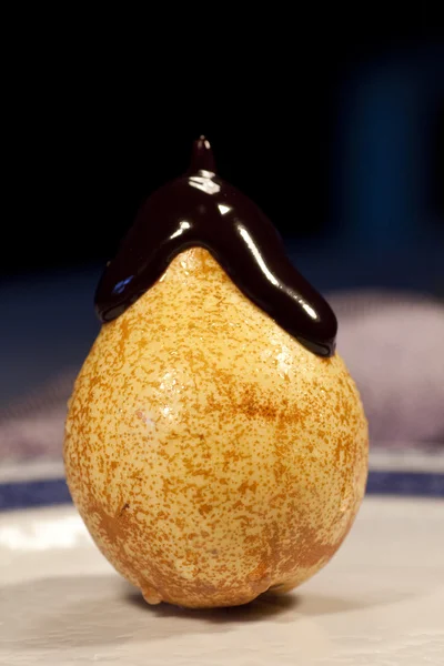 Covered chocolate pear — Stock Photo, Image