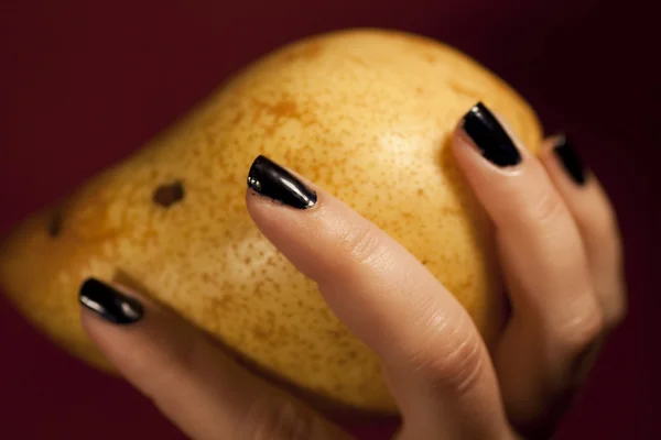 Hand holding pear — Stock Photo, Image