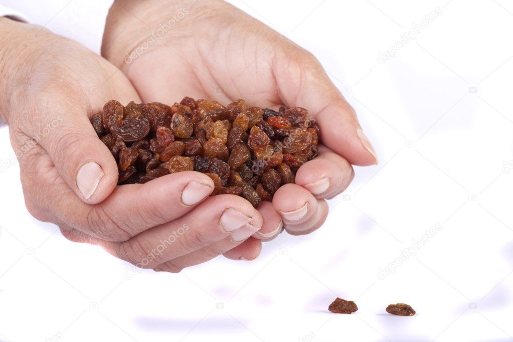 Hands with raisins — Stock Photo © membio 5233372