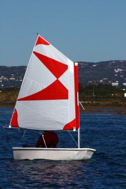 Sailing a small boat clipart