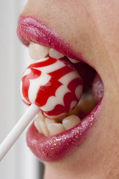 Red lips with lollipop — Stock Photo, Image