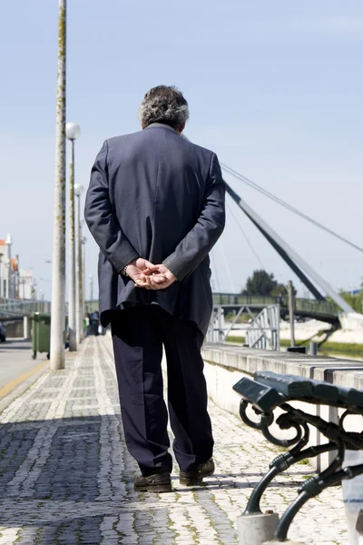 Lonely man walks on street — Stock Photo, Image