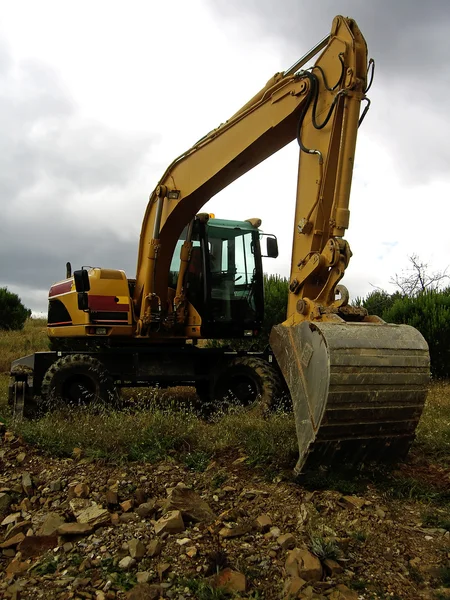 Excavator on the field — Stock Photo, Image