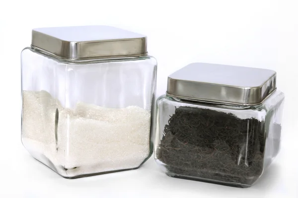 Dois jarros de vidro com chá e açúcar Fotos De Bancos De Imagens