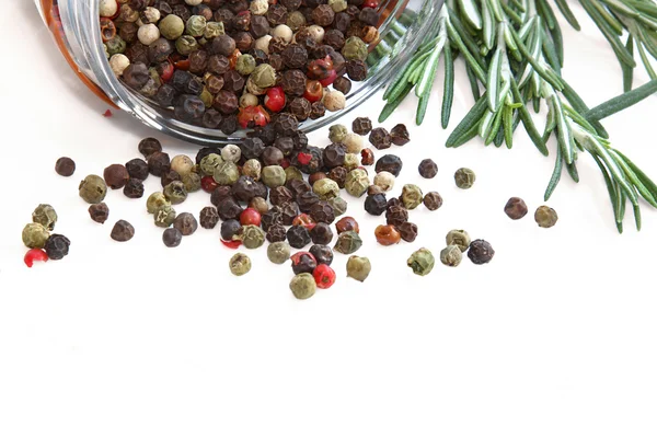 stock image Color peppercorns in glass jar