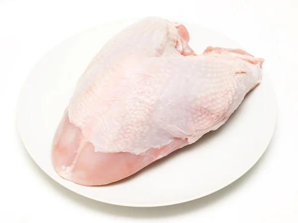 Fresh turkey crown ready to cook on a plate Stock Photo
