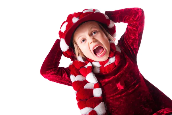 Kırmızı elbise ve komik kırmızı ve beyaz şapka giyen küçük kız — Stok fotoğraf