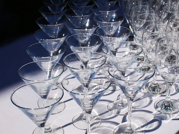 Glass goblets on white table — Stock Photo, Image