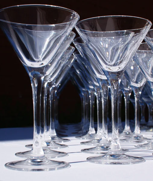 Glass goblets on white table — Stock Photo, Image