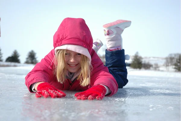 Young Girl Prone on Frozen Lake — Stock Photo, Image