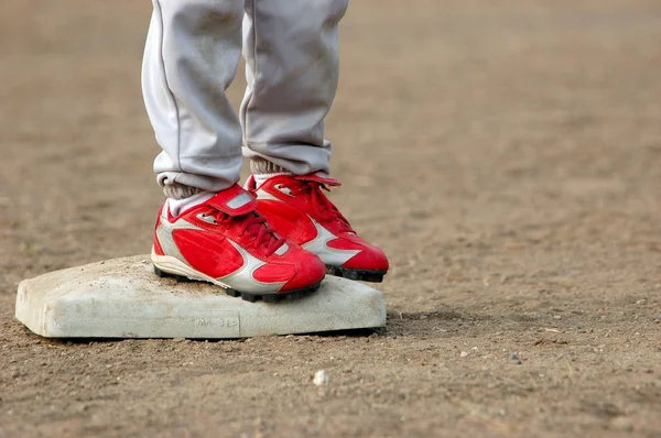 Red Cleats on Base — Stock Photo, Image