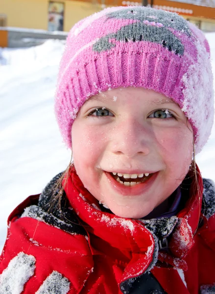 Happy little girl in the snow — Stock Photo, Image