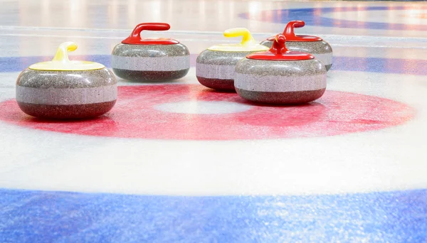 Curling-Steine lizenzfreie Stockbilder