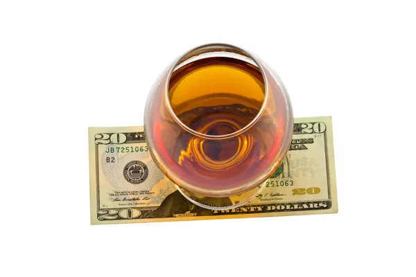 stock image Glass of alcohol with dollar