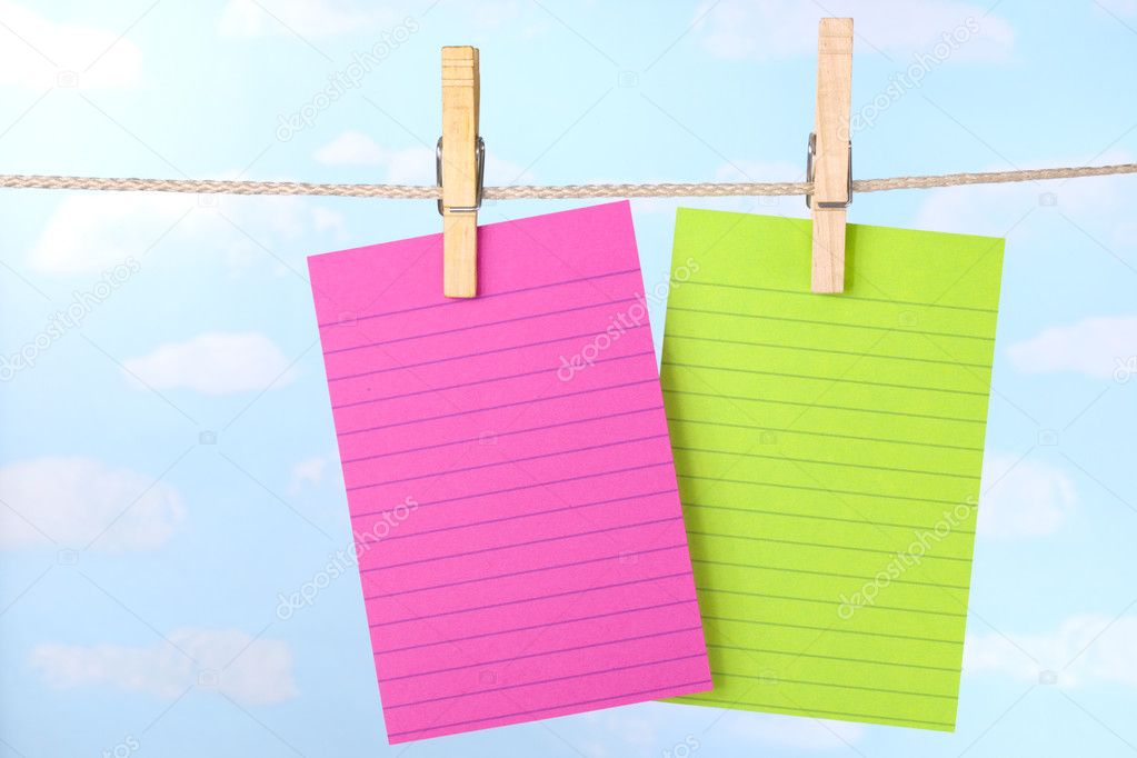Pink and green notes on clothesline