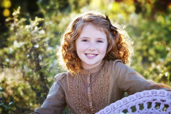 Little redheaded girl outdoors — Stock Photo, Image