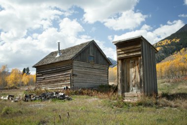 Abandoned House and Outhouse in Colorado Ghost Town clipart