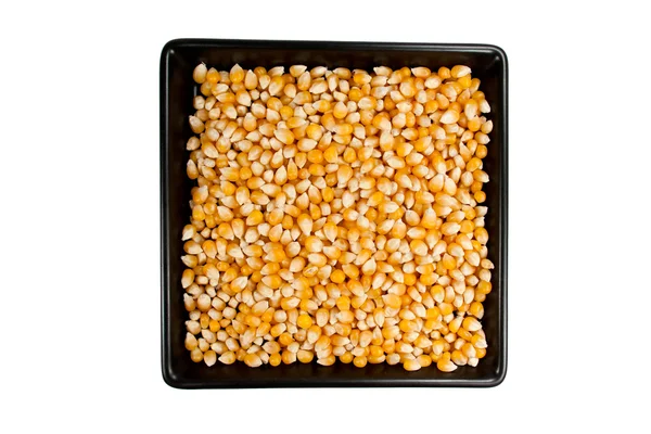 Dried mais corn on black plate — Stock Photo, Image