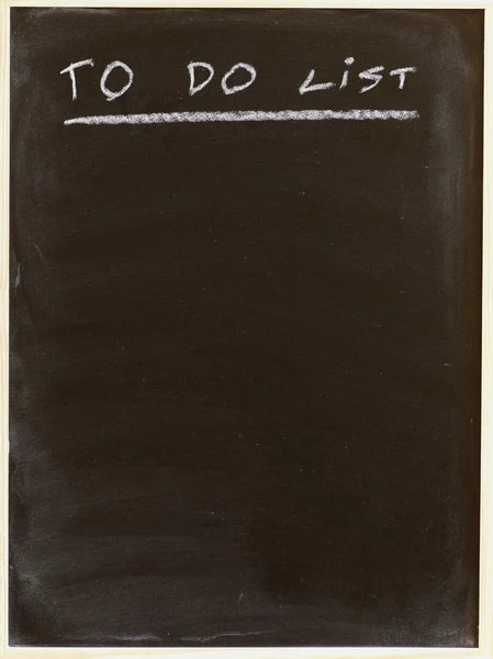 List on blackboard — Stock Photo, Image