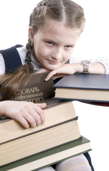 Moe meisje en grote boeken — Stockfoto