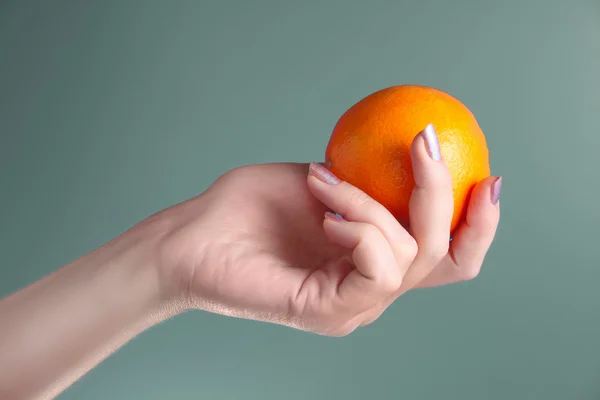 stock image Woman holds in her hand oranges