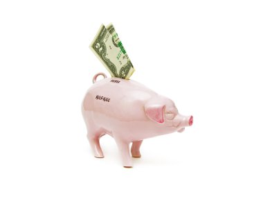 Old piggy bank and two dollars on a white background clipart