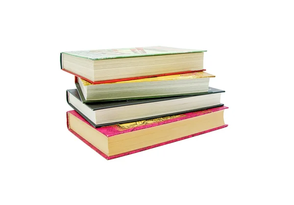 Vier boeken geïsoleerd op een witte achtergrond close-up — Stockfoto