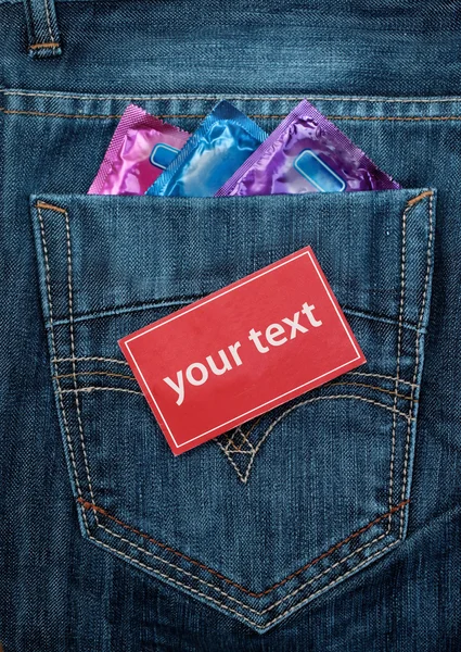 Три презерватива в джинсах — стоковое фото