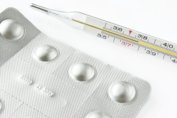 stock image Pills and thermometer