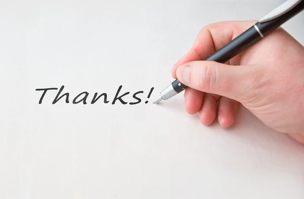 Escribir a mano Gracias palabra en papel —  Fotos de Stock
