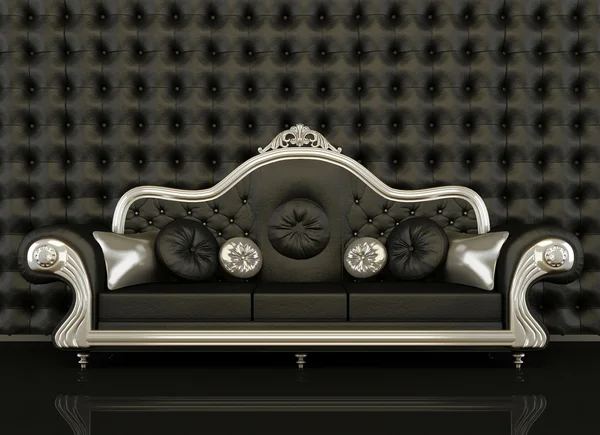 Sofá de couro clássico com uma moldura de prata no fundo preto — Fotografia de Stock