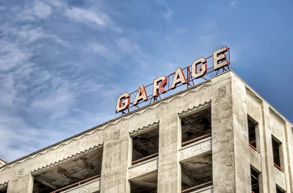 stock image Old sign on an empty garage structure